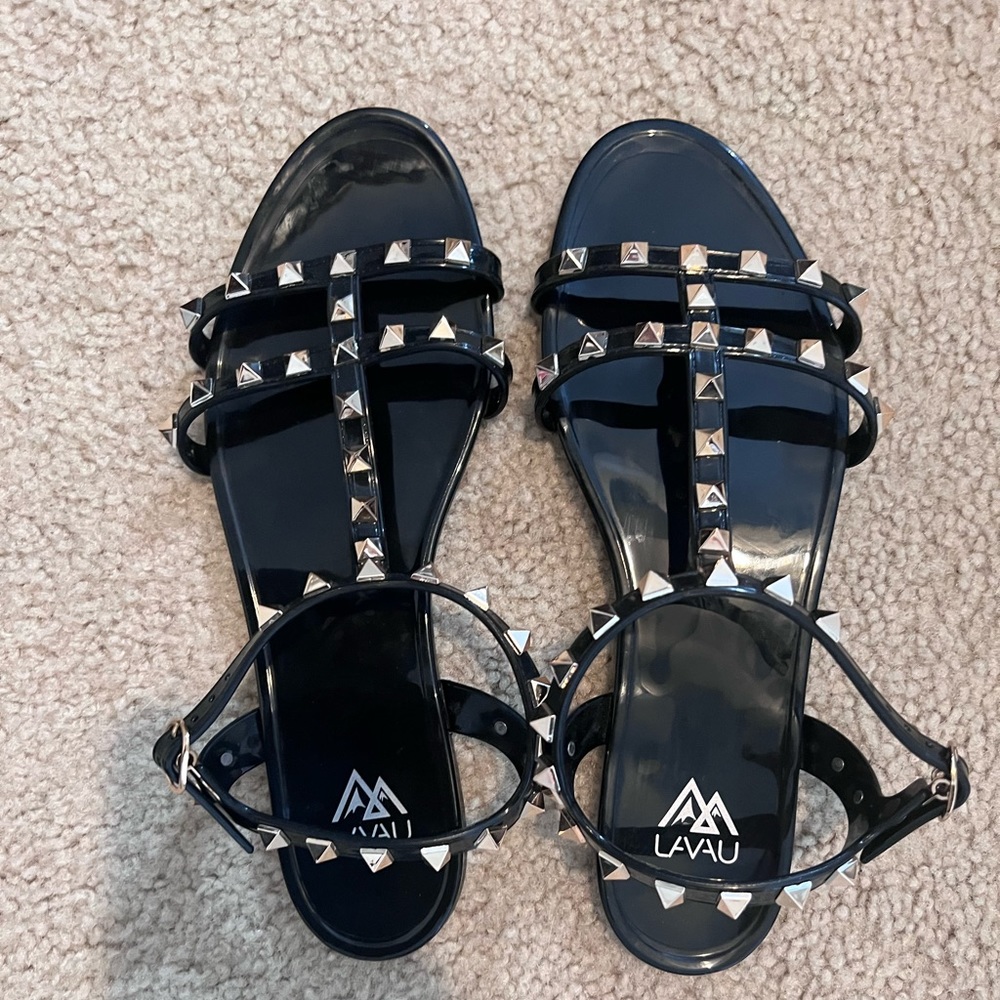 Black sandals with gold studs